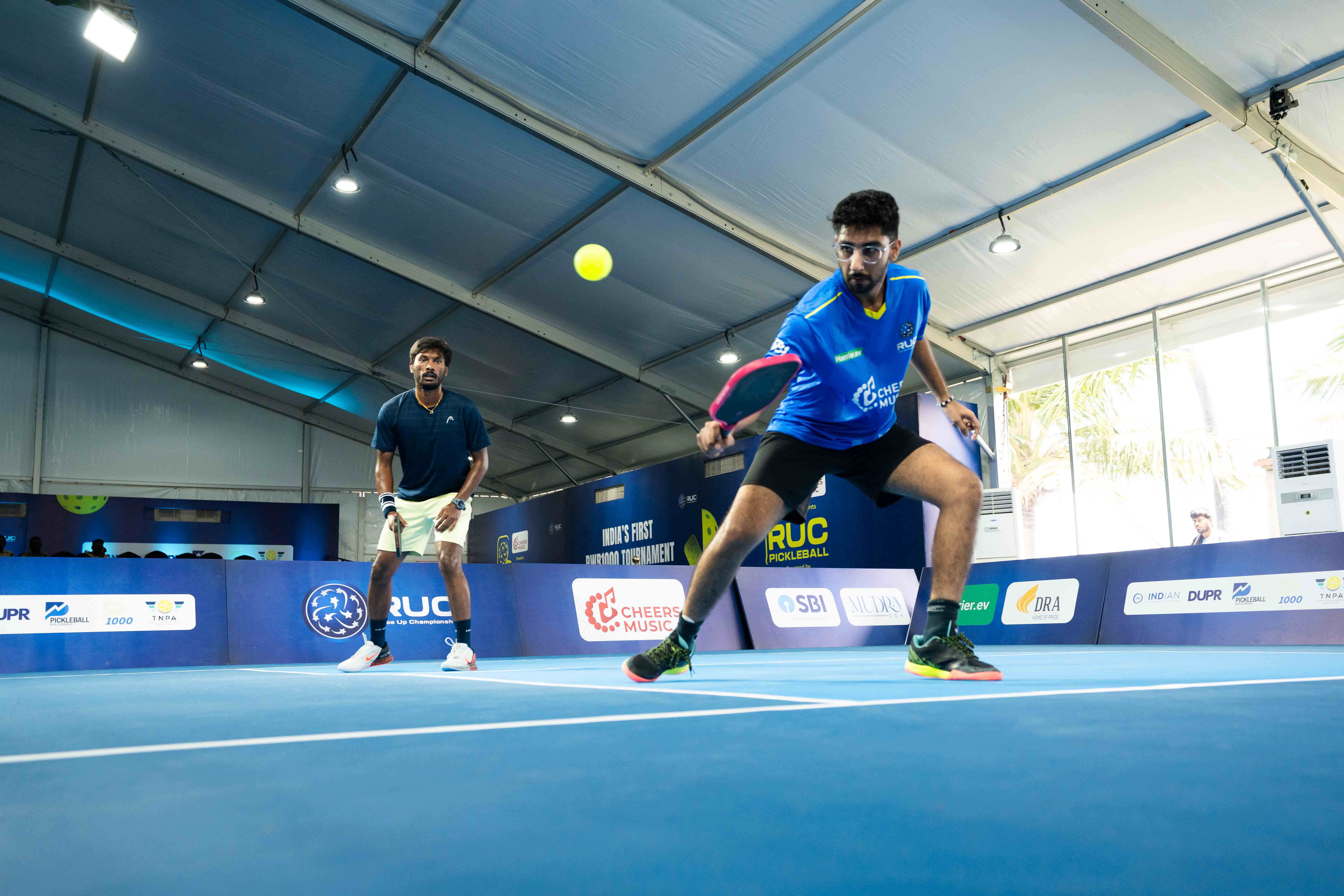 Pickleball player in action on a court